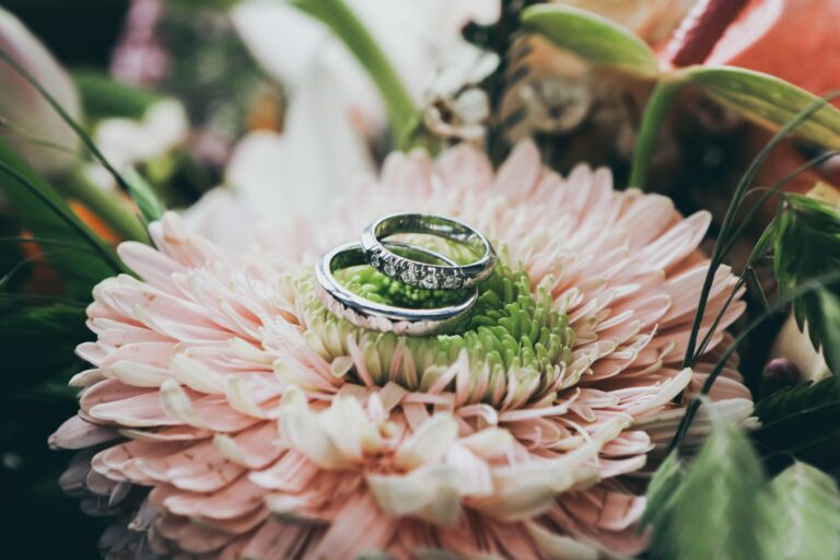 Wedding bands on a flower.